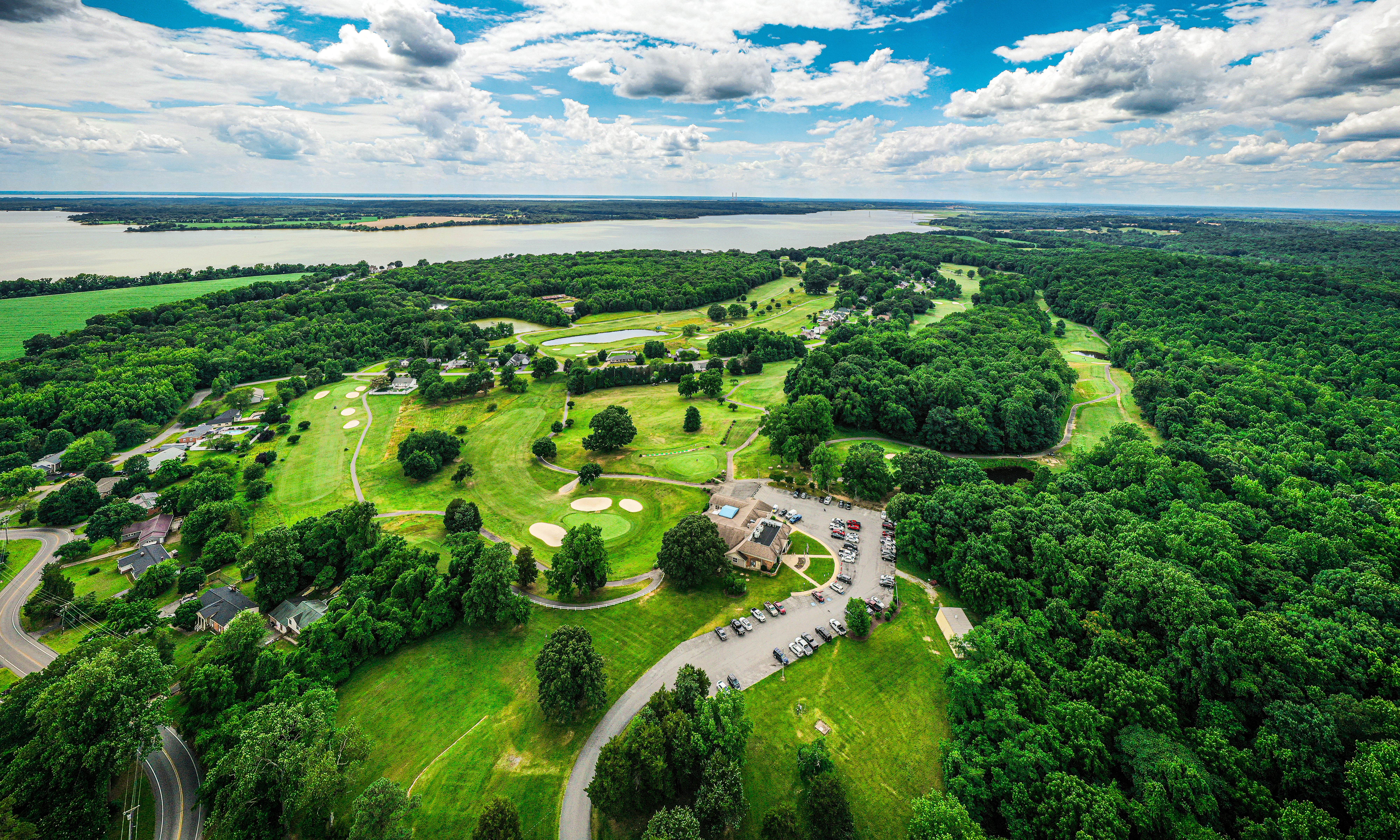 Image of golf ball on tee on grass.